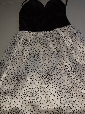 Teeze Me Black Garment with Red Heart Logo Accent